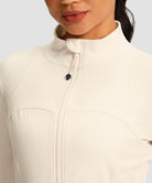women's zip-up slim fit hip length jacket in beige - collar detail view