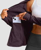 women's zip-up slim fit hip length jacket in deep purple - zipper pocket detail view